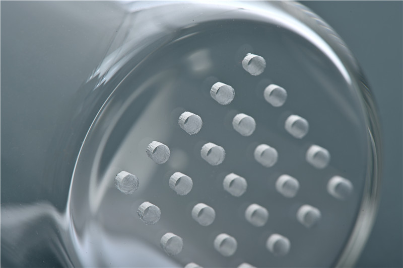 Nanosecond green lasers drill tempered glass